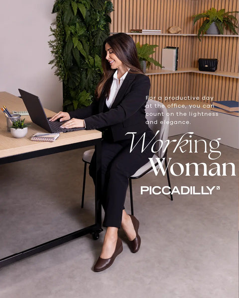 Woman wearing Piccadilly 748010 black lizard court shoe with professional business attire in office setting