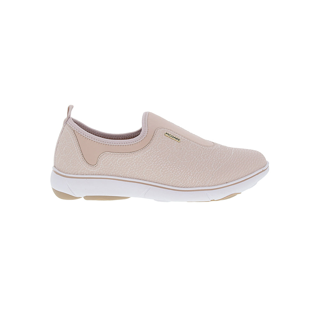 The Women Fashion Sneaker No Laces Modare 7339.101 in Cream is a beige slip-on with a textured upper, elastic side panels, and a white sole with light brown accents—ideal for versatile style and all-day comfort.
